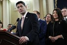 House Speaker Paul Ryan of Wis., left, speaks next to Rep. Kristi Noem, R-S.D., during a news conference announcing the GOP tax overhaul Thursday in W
