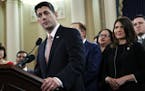 House Speaker Paul Ryan of Wis., left, speaks next to Rep. Kristi Noem, R-S.D., during a news conference announcing the GOP tax overhaul Thursday in W