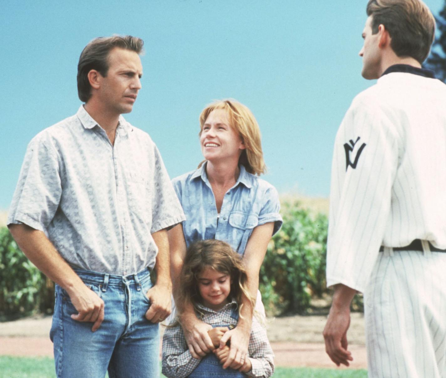 "Field of Dreams" 1989 baseball movie from Universal City Studios. (left to right) Ray Kinsella (played by Kevin Costner), his wife Annie (Amy Madigan), and daughter Karin (Gaby Hoffman), are greeted by a youthful John Kinsella (Dwier Brown), Ray's father. File photo