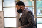Defendant Mohamed Jama Ismail walks into U.S. District Court during the third day of jury selection in the first Feeding Our Future case to go to tria