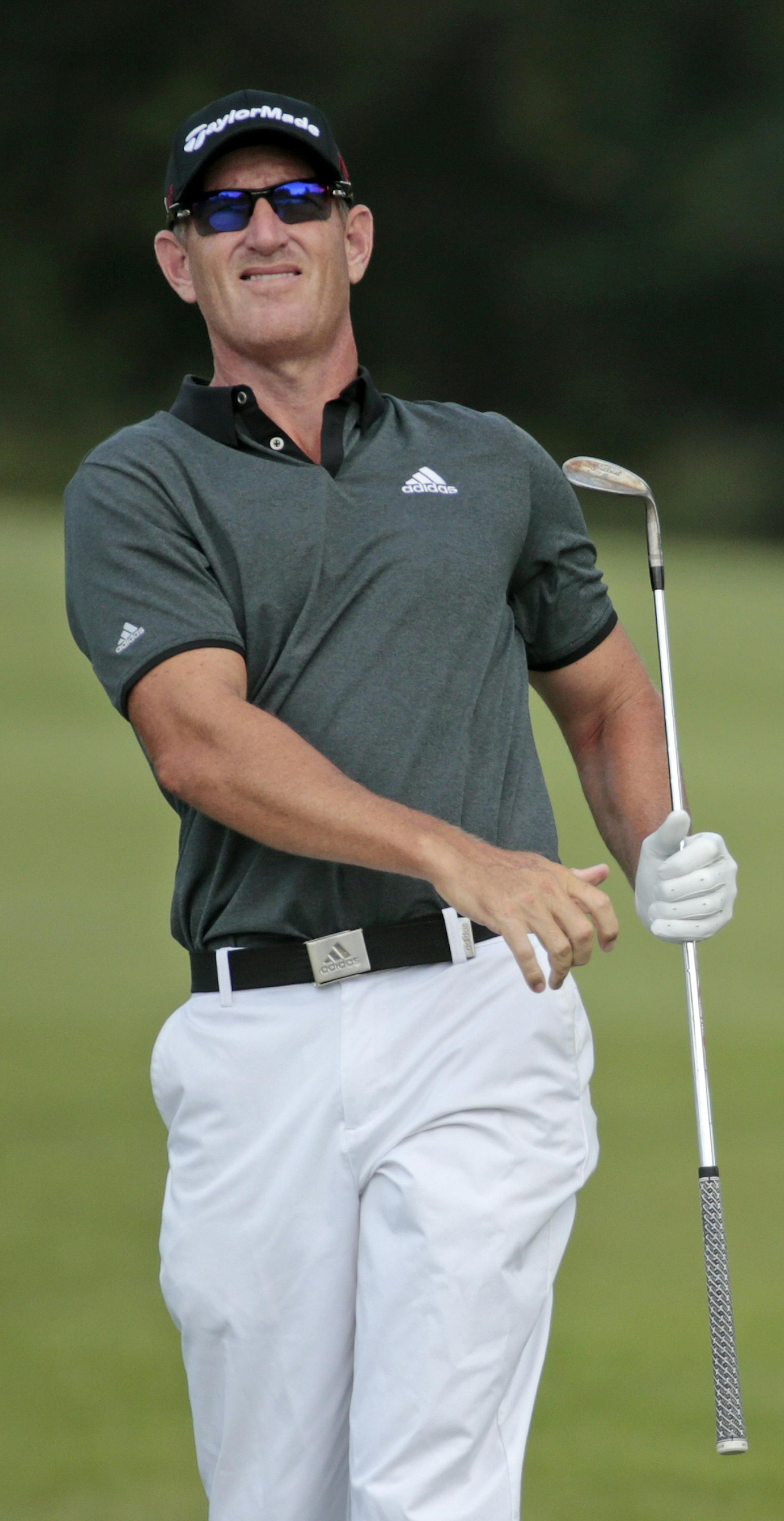 Greg Owen, of England, watches his chip shot onto the 16th green during the third round of the St. Jude Classic golf tournament Saturday, June 13, 2015, in Memphis, Tenn. Owen finished the round tied for the lead at 9-under-par 201. (AP Photo/Mark Humphrey)