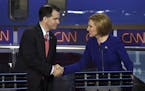 Carly Fiorina and Gov. Scott Walker of Wisconsin shake hands after the Republican debate at the Ronald Reagan Presidential Library in Simi Valley, Cal