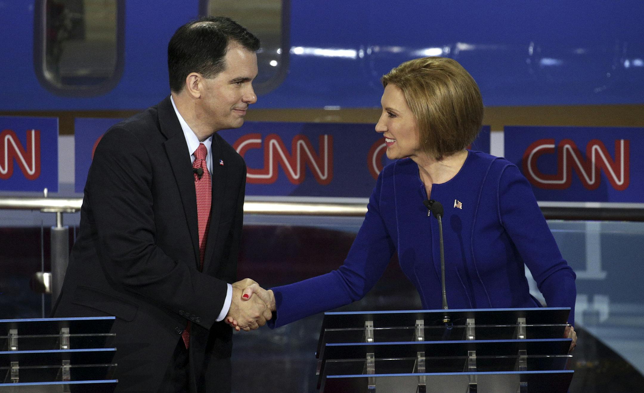 Carly Fiorina and Gov. Scott Walker of Wisconsin shake hands after the Republican debate at the Ronald Reagan Presidential Library in Simi Valley, Calif., Sept. 16, 2015. Eleven candidates took part in the debate. (Max Whittaker/The New York Times) ORG XMIT: MIN2015092212323926