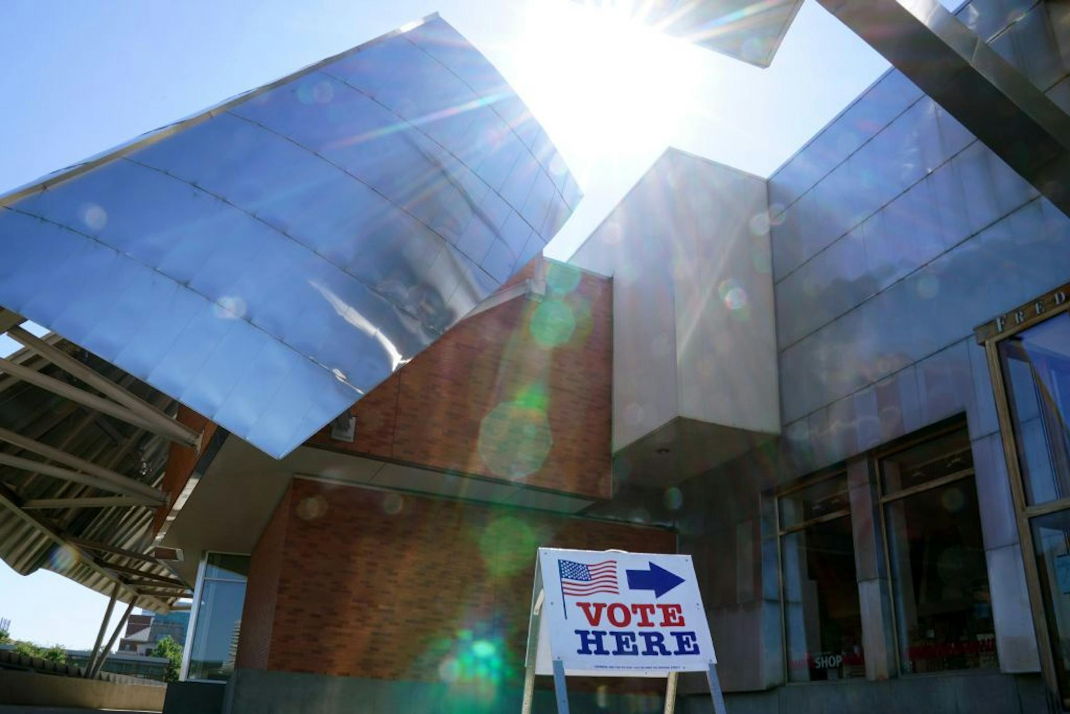 A sign directed voters into the Frederick R. Weisman Art Museum for them to cast their primary ballots Tuesday morning at the University of Minnesota in Minneapolis.