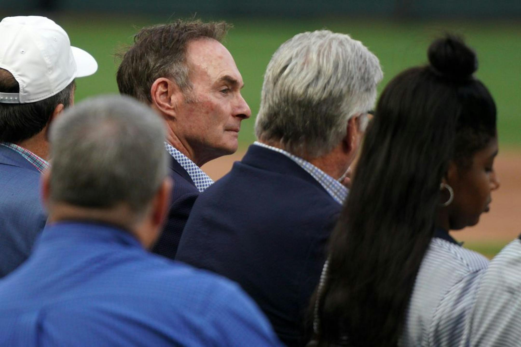 Former Minnesota Twins manager Paul Molitor sat on the field during a pregame ceremony to retire Twins great Joe Mauer's number 7 Saturday.