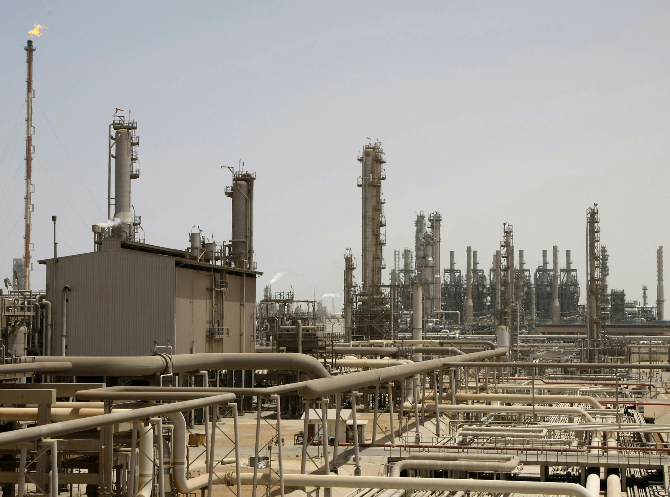 FILE - This May. 3, 2009 file photo shows an oil facility in Jubeil, about 600 kilometers (370 miles) from Riyadh, Saudi Arabia. Saudi Arabia formally started its long-anticipated initial public offering of its state-run oil giant Saudi Aramco on Sunday, which will see a sliver of the firm offered on a local stock exchange in hopes of raising billions of dollars for the kingdom. (AP Photo/Hassan Ammar, File)