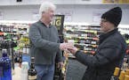 United Liquors manager Dan Condon handed out coffee with Irish cream to customers during its weekly "Sunday Funday" to try to get more people to the s