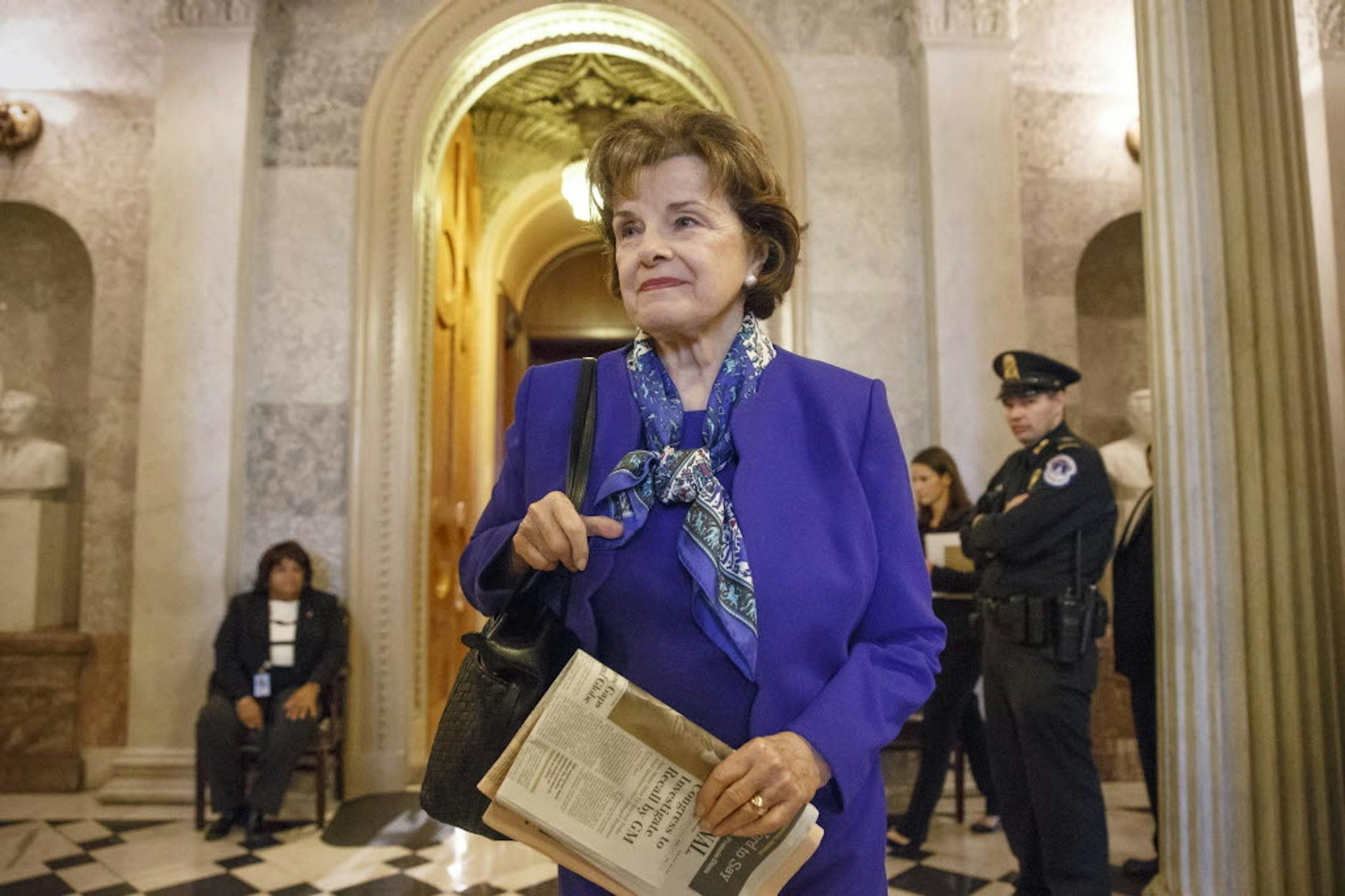 In this March 11, 2014, photo, Sen. Dianne Feinstein, D-Calif., chair of the Senate Intelligence Committee, leaves the chamber just after saying that the CIA's improper search of a stand-alone computer network established for Congress has been referred to the Justice Department, at the Capitol in Washington.
