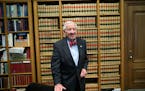 FILE -- Then-Justice John Paul Stevens in his chambers at the Supreme Court, in Washington, April 15, 2014. Stevens, whose 35 years on the United Stat