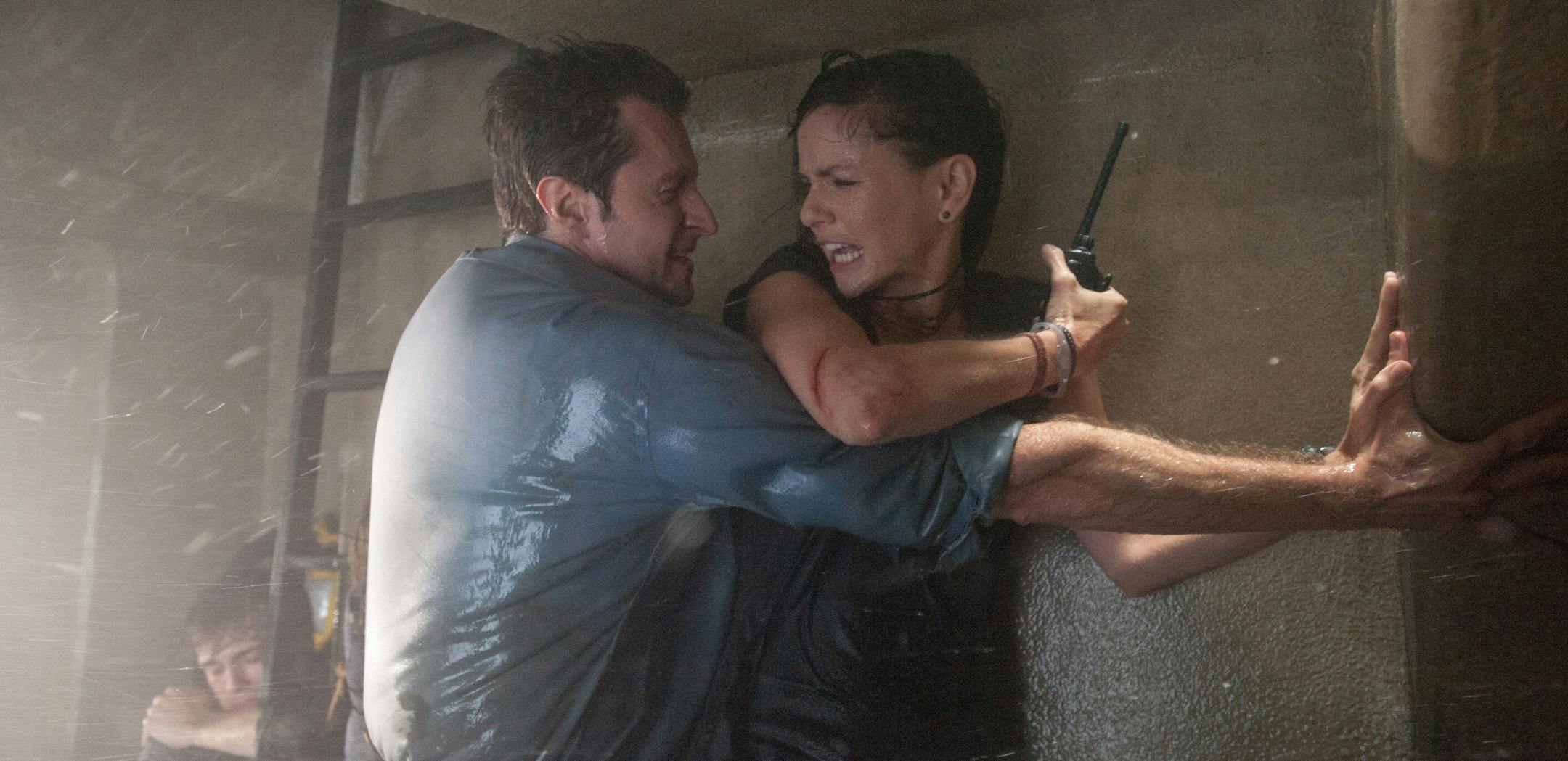 UTP-12612 Film Name: INTO THE STORM Copyright: ¬© 2014 WARNER BROS. ENTERTAINMENT INC. - - U.S., CANADA, BAHAMAS & BERMUDA AND ¬© 2014 VILLAGE ROADSHOW FILMS (BVI) LIMITED - - ALL OTHER TERRITORIES. ALL RIGHTS RESERVED. Photo Credit: Ron Phillips Caption: (L-r) MAX DEACON as Donnie (background), RICHARD ARMITAGE as Gary and SARAH WAYNE CALLIES as Allison in New Line Cinema's and Village Roadshow Pictures' thriller "INTO THE STORM," a Warner Bros. Pictures release.