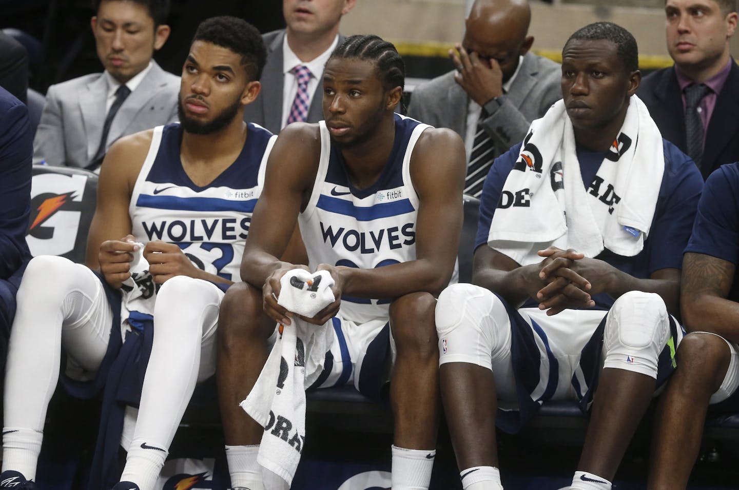 Minnesota Timberwolves' Karl-Anthony Towns, left, Andrew Wiggins, center, and Gorgui Dieng of Senegal watch from the bench late in the fourth quarter of an NBA basketball game Tuesday, Oct. 24, 2017, in Minneapolis. The Pacers won 130-107. (AP Photo/Jim Mone)