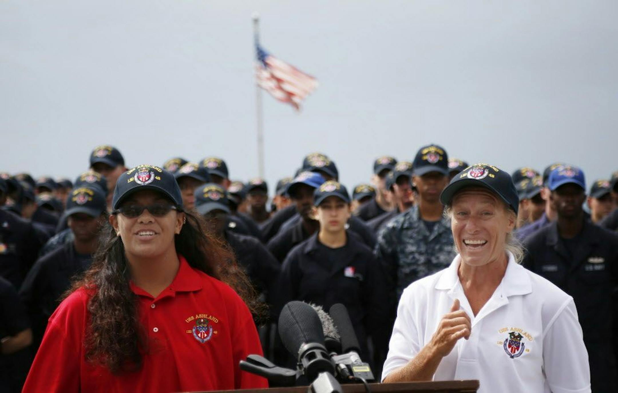Jennifer Appel, right, and Tasha Fuiava speak on the deck of the USS Ashland at White Beach Naval Facility in Okinawa, Japan Monday, Oct. 30, 2017. The U.S. Navy ship arrived at the American Navy base, five days after it picked up the women and their two dogs from their storm-damaged sailboat, 900 miles southeast of Japan.