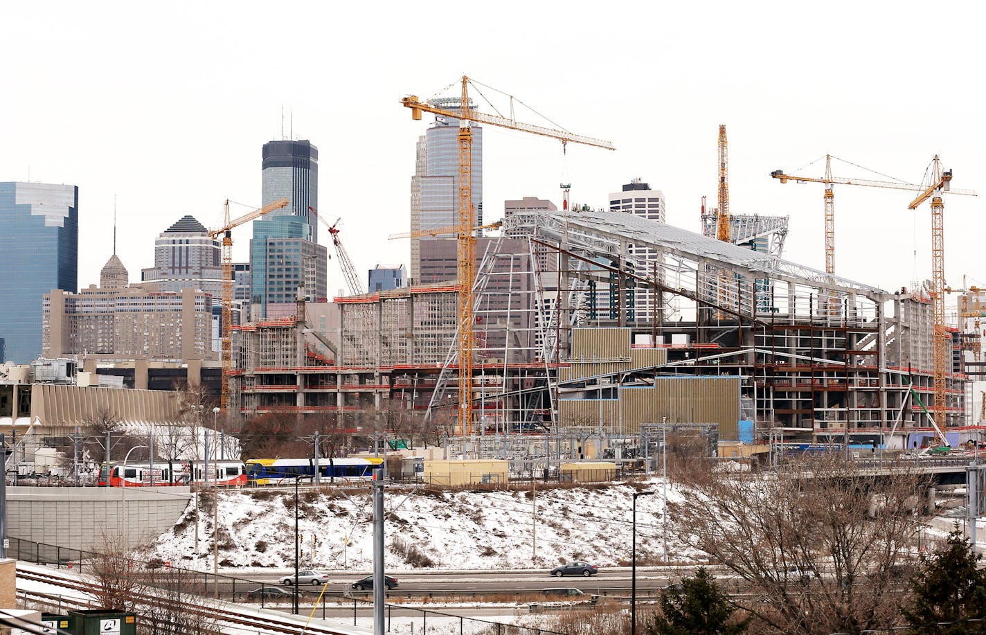 Construction of Vikings stadium in downtown Minneapolis is seen from the Cedar-Riverside neighborhood on Friday, January 2, 2015. ] LEILA NAVIDI leila.navidi@startribune.com /