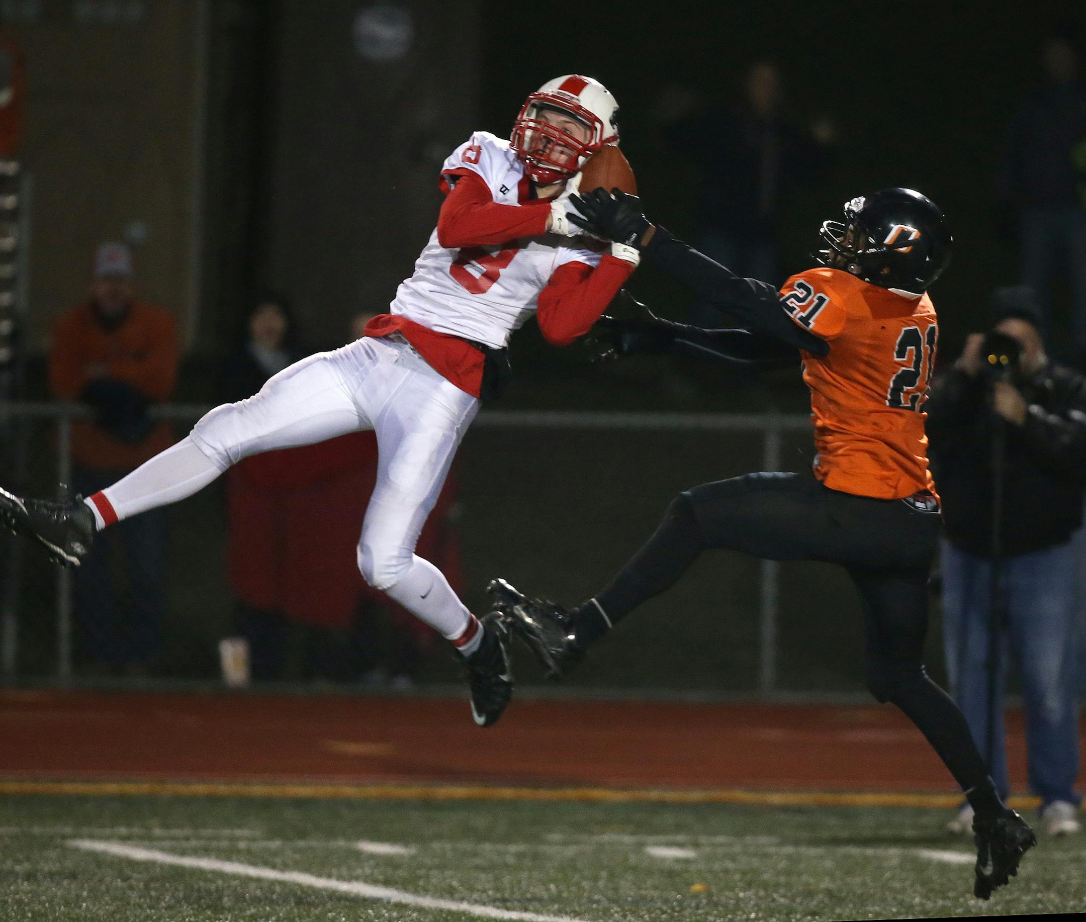 Osseo's Damario Armstrong pulled the ball out of Lakeville North's Nick Fossey during the second half. ] (KYNDELL HARKNESS/STAR TRIBUNE) kyndell.harkness@startribune.com Osseo vs Lakeville North during Class 6A football state quarterfinals in Eden Prairie Min., Thursday October 29, 2015. Osseous won over Lakeville North 24-21.