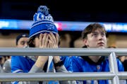 Detroit Lions fans react in the second half during a watch party as their team lost a 17-point lead and a chance at the Super Bowl.