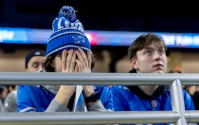 Detroit Lions fans react in the second half during a watch party as their team lost a 17-point lead and a chance at the Super Bowl.
