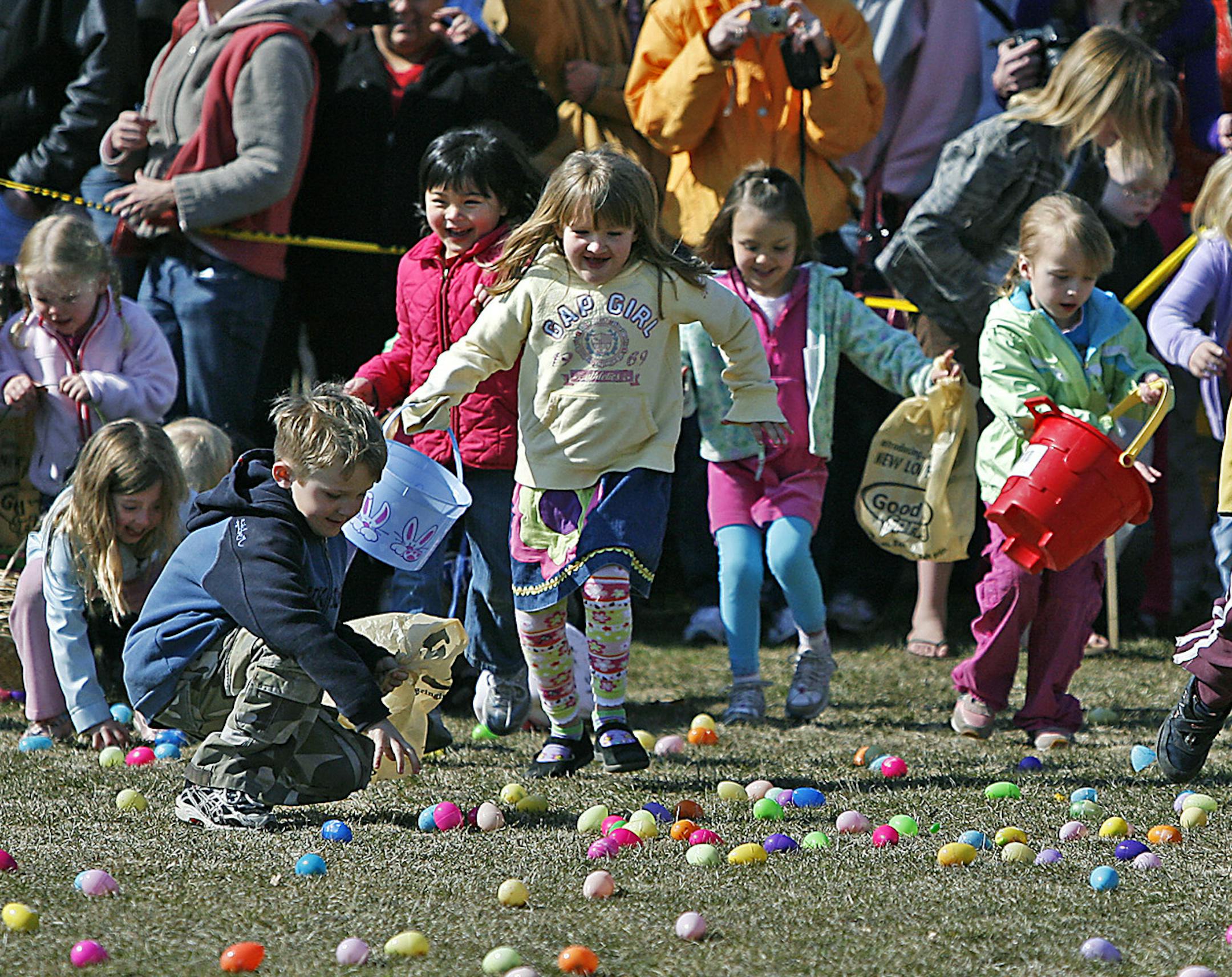 ELIZABETH FLORESï eflores@startribune.com April 11, 2009 - Excelsior, MN - Children raced to grab candy-filled eggs during the 11th Annual Community Easter Egg Hunt at Excelsior Commons Park. The event, which provided 8,000 eggs was hosted by Our Savior Lutheran Church. A firetruck, puppet shows, food, and entertainment were availabe to the more than 500 children from the West metro area. The event started ten years ago with 200 eggs.