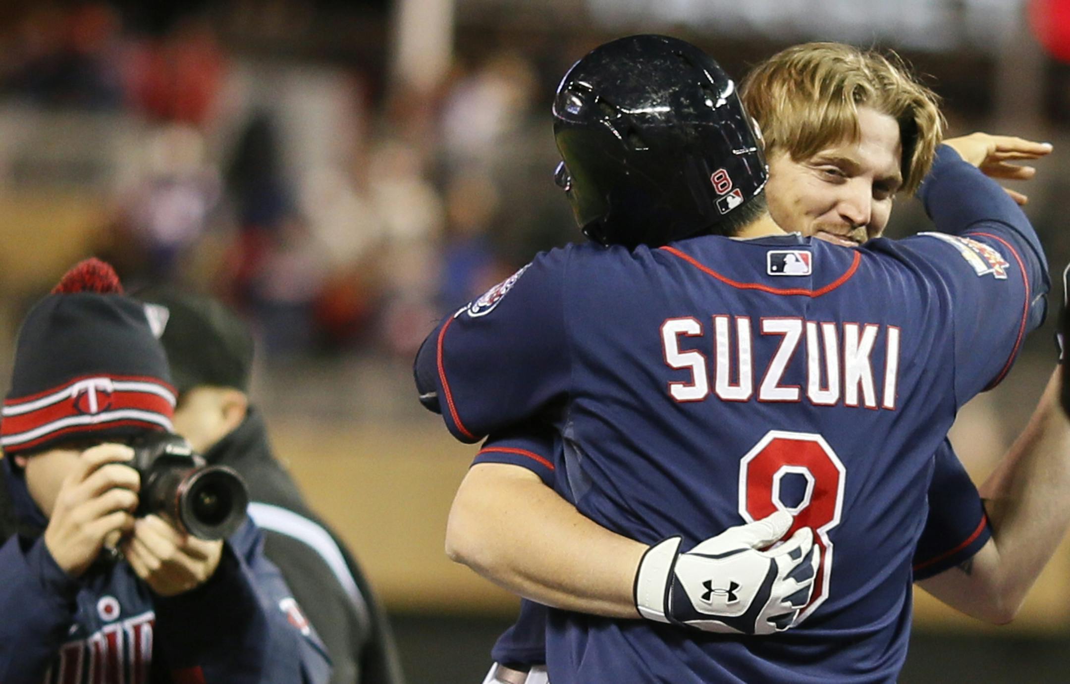 Minnesota Twins catcher Kurt Suzuki (8) celebrated Chris Parmelee (27) two run winning homer in the ninth inning give Minnesota a 8-6 win over Boston at Target Field Tuesday May 13, 2014 in Minneapolis , MN.