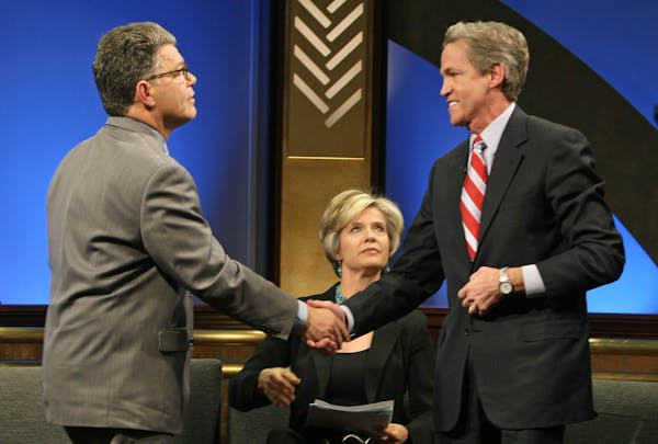 Al Franken and Norm Coleman debated on TPT's Almanac. Co-host Cathy Wurzer is seated.