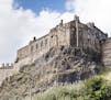 Edinburgh Castle looms above the Old Town district of the Scottish capital.