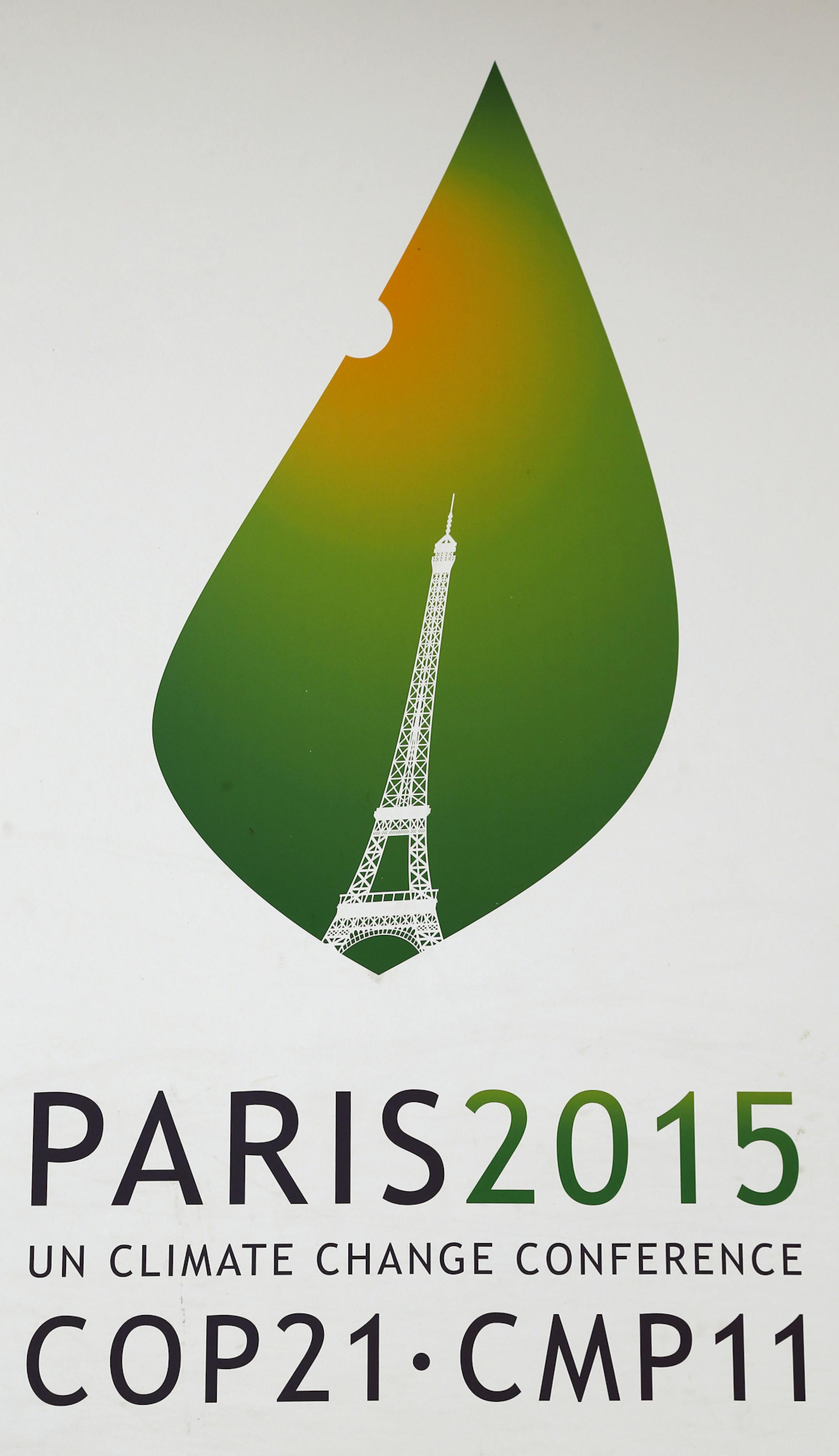 The logo of the COP21 is pictured on a banner promoting the Climate conference and hanging outside the French Foreign Ministry in Paris. Monday, Nov.2, 2015. The Paris conference, known as COP21, runs Nov. 30-Dec 11. (AP Photo/Jacques Brinon)