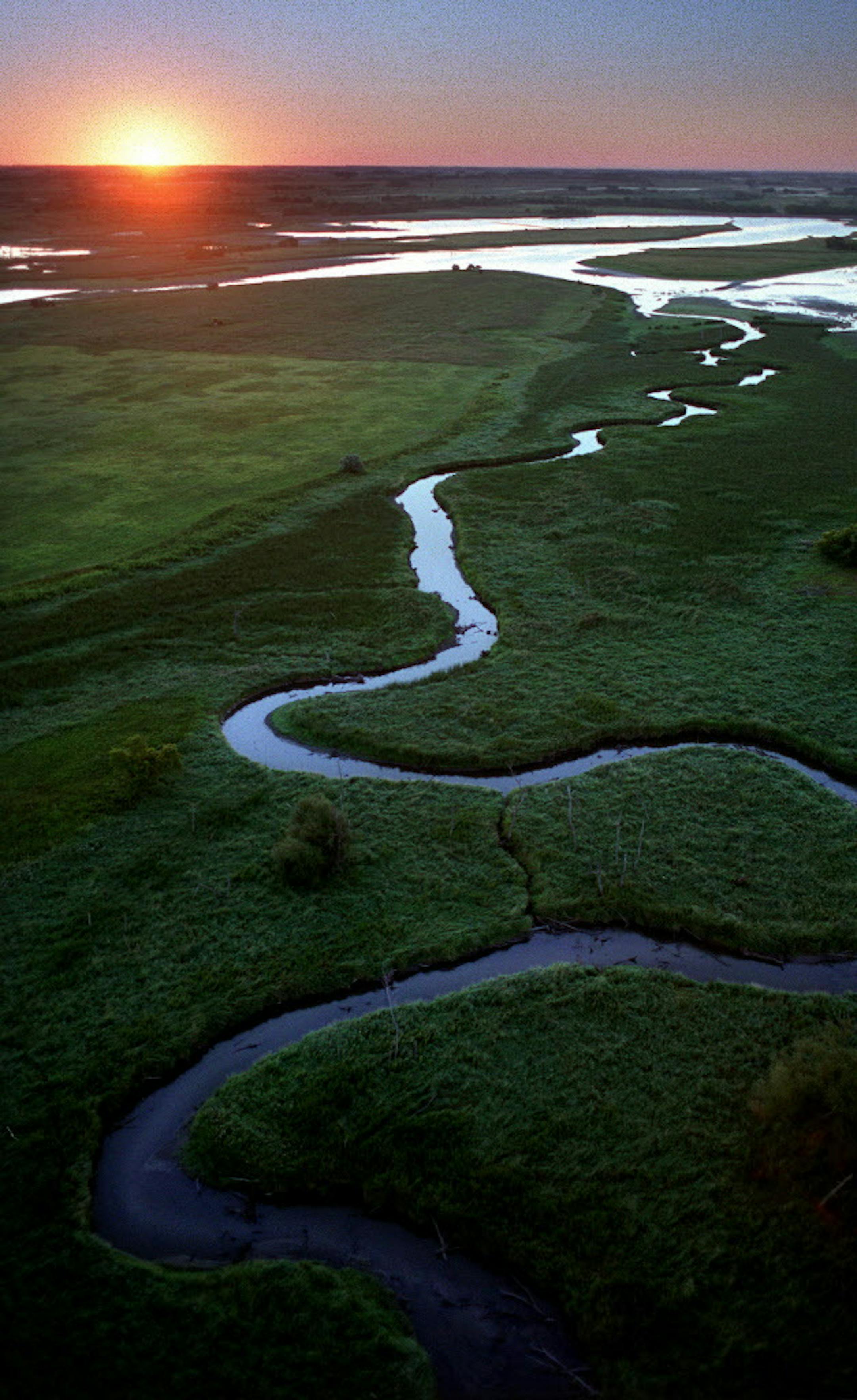 Near its beginning the Minnesota River is a beautiful place. Here, as it winds through Big Stone National Wildlife Refuge south east of Ortonville, the refuge serves as a major water fowl production and migration area and also contains more than 6,000 acres of grassland, including large tracts of native prairie. ORG XMIT: MIN2014091915422655 ORG XMIT: MIN1409191917113756