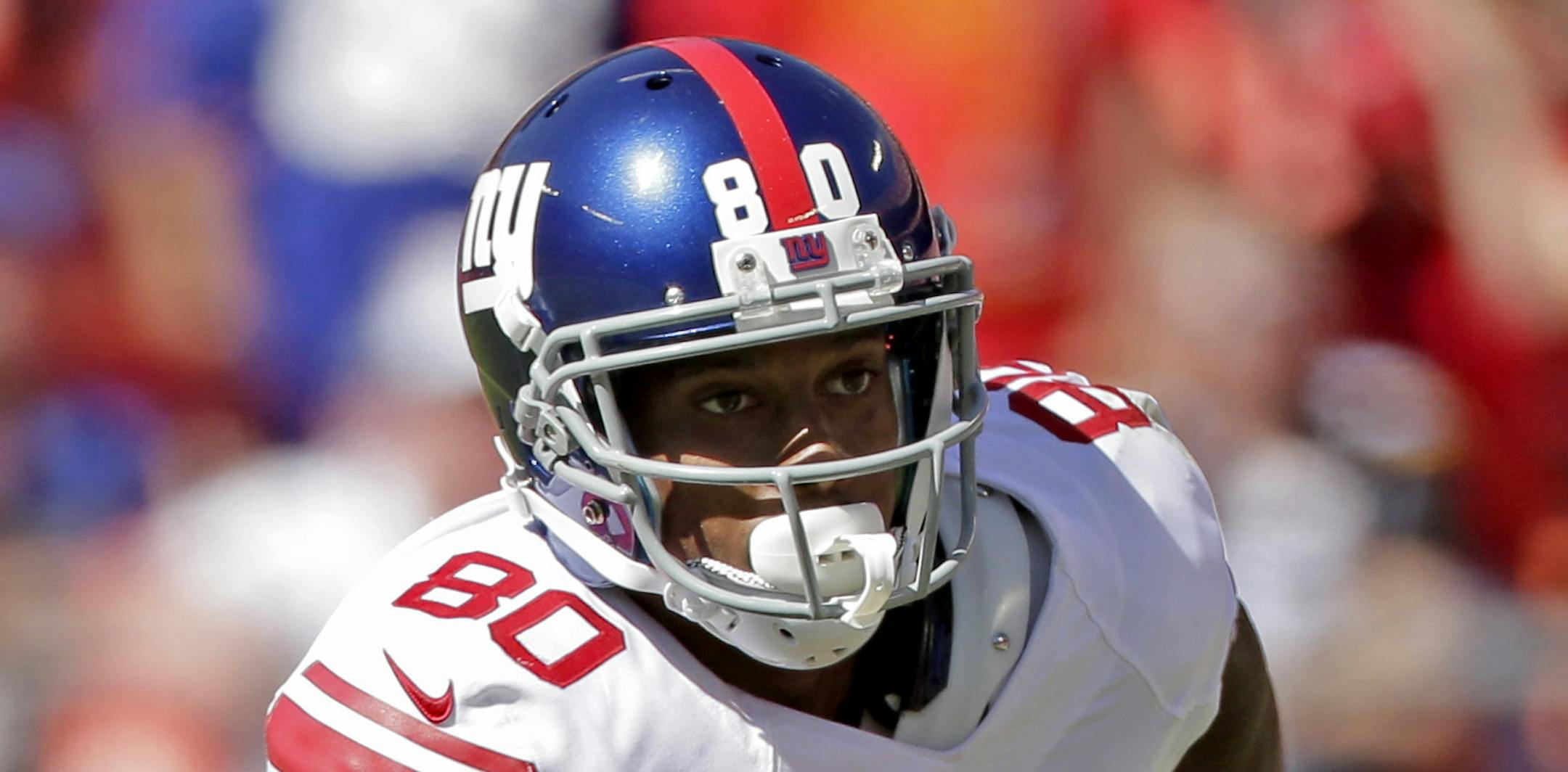 New York Giants wide receiver Victor Cruz (80) runs during the first half of an NFL football game against the Kansas City Chiefs at Arrowhead Stadium in Kansas City, Mo., Sunday, Sept. 29, 2013. (AP Photo/Charlie Riedel) ORG XMIT: NYOTK
