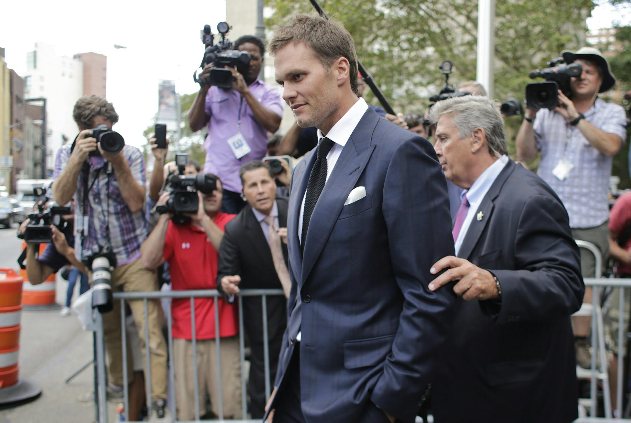 New England Patriots quarterback Tom Brady leaves federal court Wednesday, Aug. 12, 2015, in New York. Brady left the courthouse after a full day of talks with a federal judge in his dispute with the NFL over a four-game suspension. (AP Photo/Frank Franklin II)