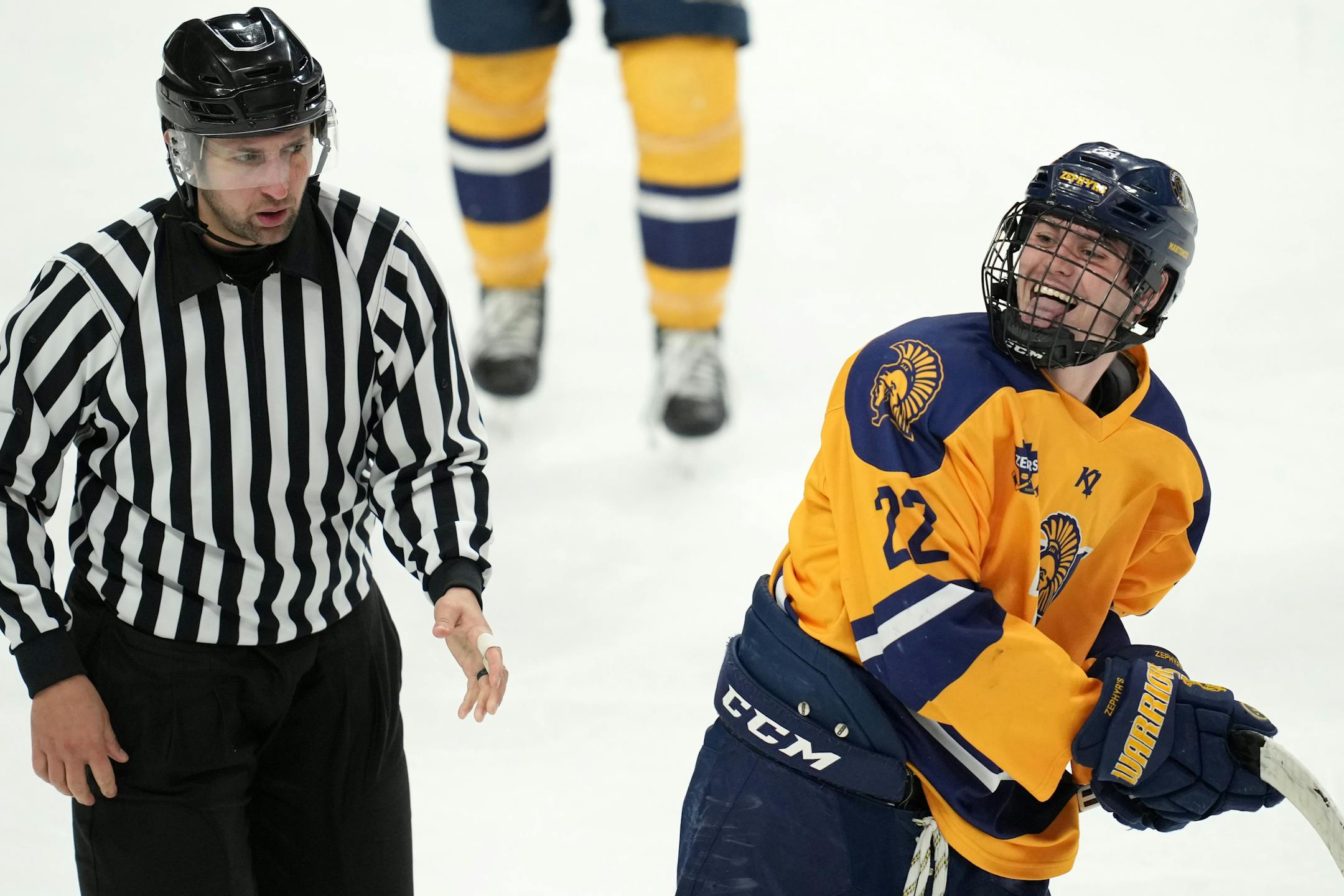 Mahtomedi forward Carter Haycraft (22) laughs as he's taken to the penalty box after tangling with Alexandria defenseman Jack Lamski (2) in the third period of a MSHSL Class 1A quarterfinal hockey game between Alexandria and Mahtomedi.