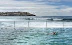 A swimmer doing laps in the 50-meter pool at the yearround Bondi Icebergs Club on the south end of the famous beach. ] Travel story on coastal beaches
