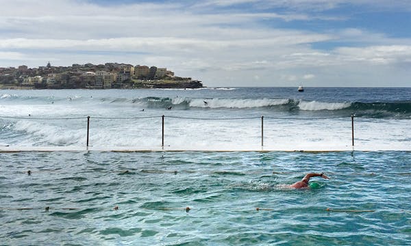 A swimmer doing laps in the 50-meter pool at the yearround Bondi Icebergs Club on the south end of the famous beach. ] Travel story on coastal beaches