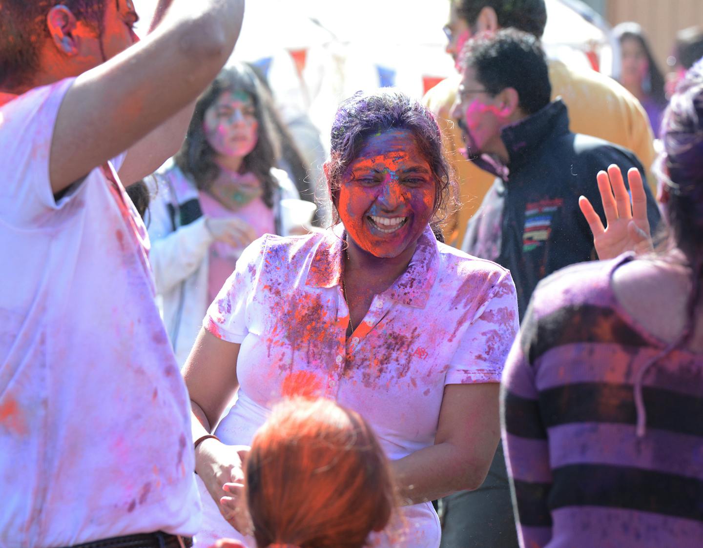 Rajni Saride, of Minneapolis, danced with friends at a Holi festival in Farmington. Photo by Liz Rolfsmeier