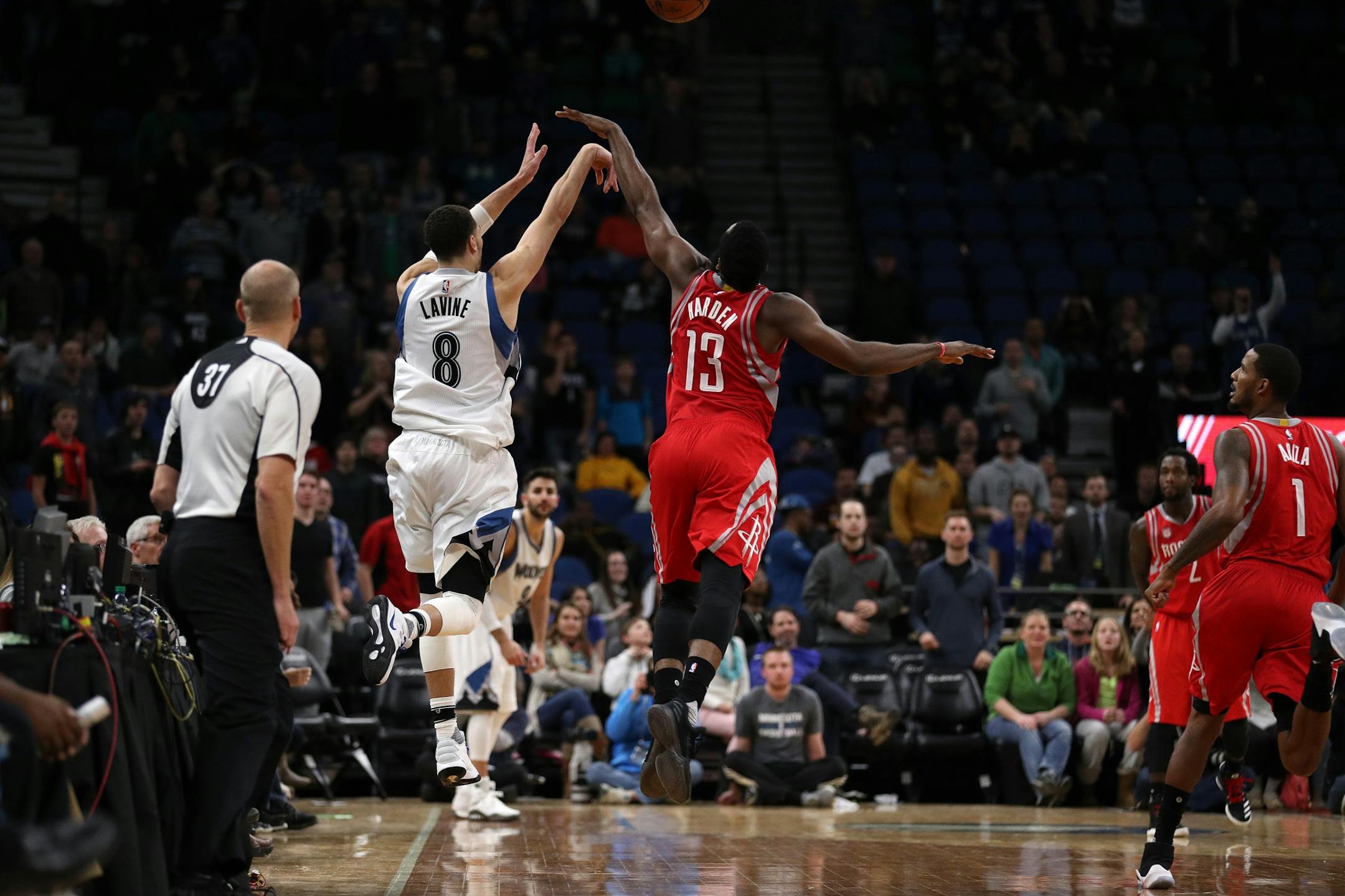 Houston Rockets guard James Harden (13) reaches out to block a last second shot attempt by Minnesota Timberwolves guard Zach LaVine (8) in overtime.