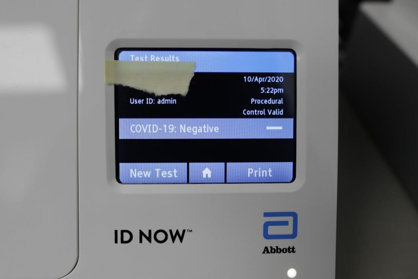 The test results for a patient are displayed on the Abbott Laboratories ID Now testing machine at Detroit Health Center, Friday, April 10, 2020, in Detroit. Dozens of Detroit police officers have been returning to work from the coronavirus quarantine daily due to the speed of the results. Illinois-based Abbott Laboratories says its cartridge-based test, approved last month, delivers results within minutes. "We're prioritizing delivery to outbreak hotspots across the country for front-line health