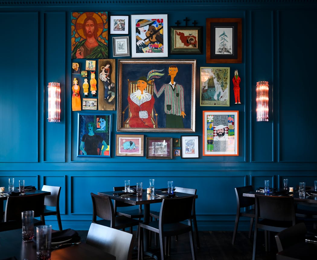 The private dining area at Mr. Paul’s boasts artwork collected by executive chef and owner Tommy Begnaud and his father and grandfather, Mr. Paul.