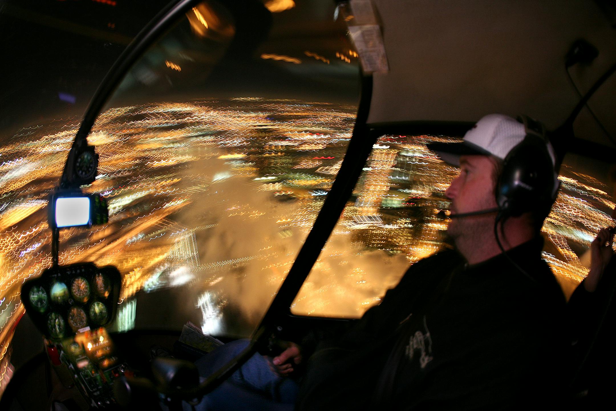 Bob Krier, co-owner of Hawk Eye Helicopter service, flew over downtown St. Paul. Owners Krier and Brian Wentworth offer flights that allow passengers to view the Christmas lights from the air. Roughly the whole metro area is within the reach of a one-hour flight (which, incidentally, costs $550).