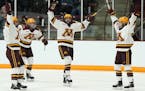 Minnesota Golden Gophers players celebrated on the ice after forward Sarah Potomak (26) scored in the first period. ] ANTHONY SOUFFLE &#x2022; anthony