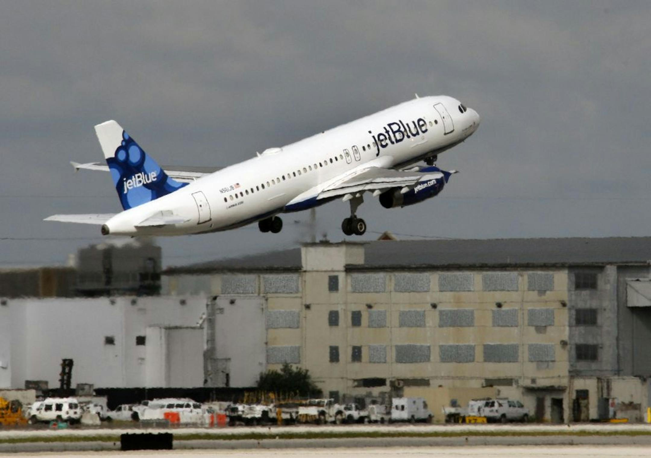 FILE - In this file photo made Oct. 26, 2009, a JetBlue plane takes off from Miami International Airport.