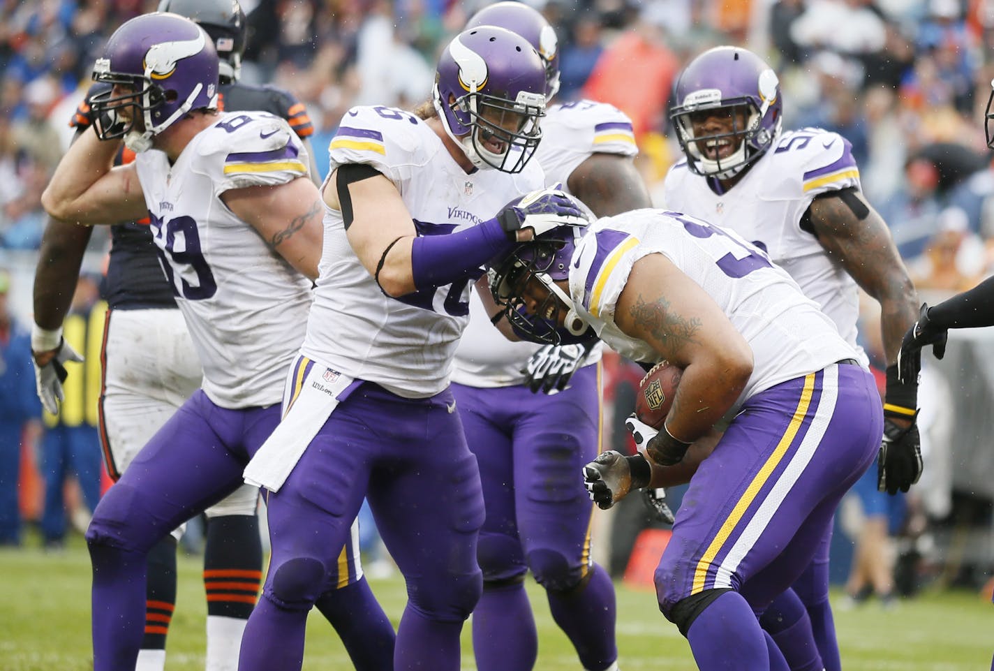 Brian Robison (96) celebrated with Kevin Williams (93) after his interception in the second quarter during NFL action between the Chicago Bears and Minnesota Vikings at Soldier Field Sunday September 15, 2013 in Chicago , IL. ] JERRY HOLT &#x201a;&#xc4;&#xa2; jerry.holt@startribune.com