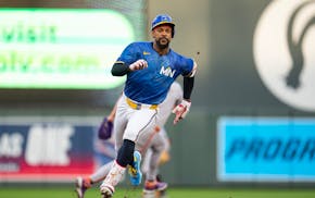 Twins center fielder Byron Buxton rounds second base on his way to a triple against the San Francisco Giants in the first inning Friday at Target Fiel