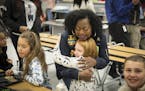 Valerie Castile, mother of Philando Castile, greeted children in the lunchroom he worked at as she arrived to announce a donation from the "Philando F