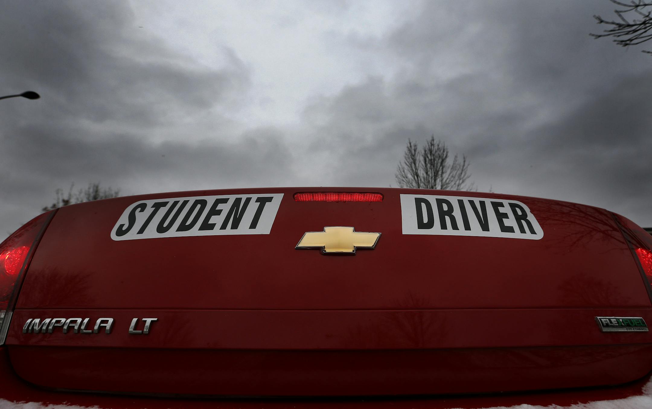 A car marked for student drivers waited to be driven by student driver Soua Xiong, 15, during a lesson with driving instructor John Ertz on Monday afternoon. ] CARLOS GONZALEZ cgonzalez@startribune.com - November 24, 2014, St. Paul, Minn., Highland Park High School, teenage drivers under age 18 will have to spend a minimum of 10 more hours behind the wheel while being supervised by an adult and submit written documentation of those hours under a new law that go into effect on Jan. 1.