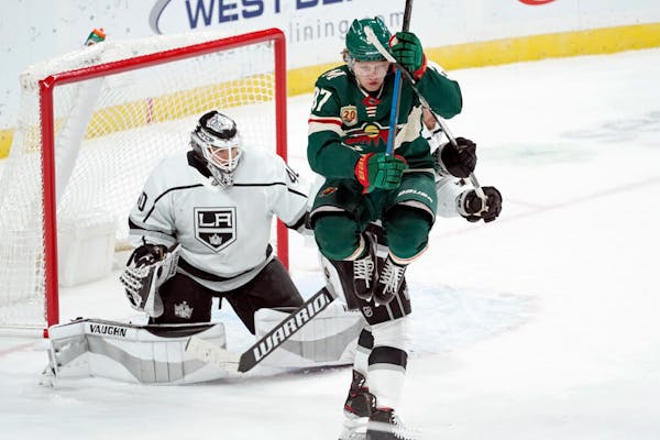 Wild rookie Kirill Kaprizov jumped to clear the way for a shot against Kings goalie Calvin Petersen in the third period Tuesday night. The Kings won 2