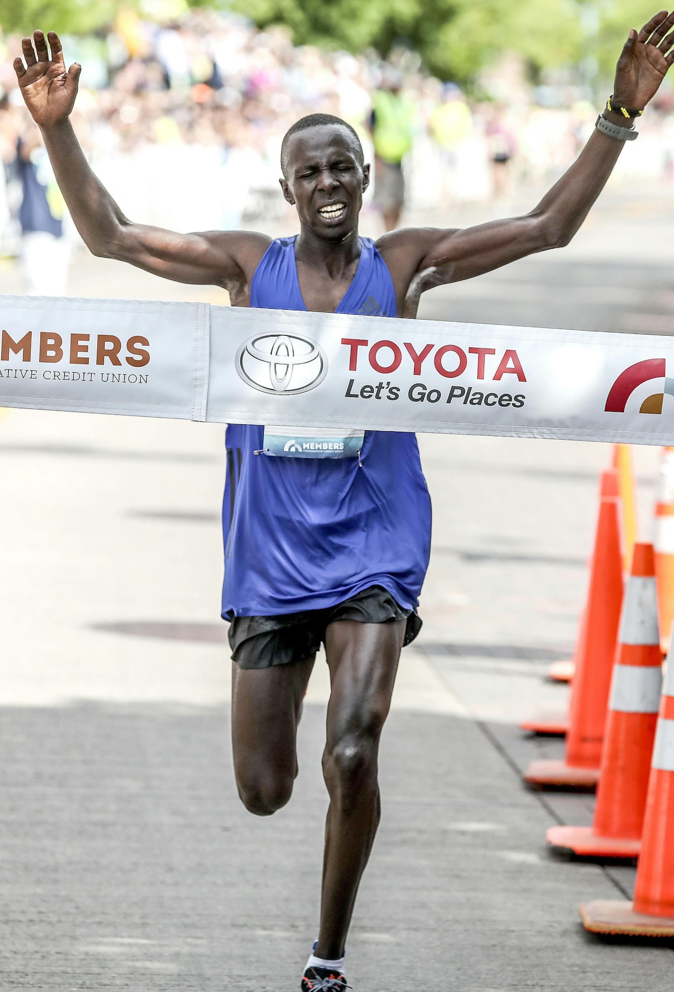 t051917 --- Clint Austin --- 091917.N.DNT.GRANDMAS.C59 --- Elisha Barno celebrates at the finish line of Grandma's Marathon Saturday morning in Duluth. Barno won with at time of 2:12:06 (Clint Austin / caustin@duluthnews.com)