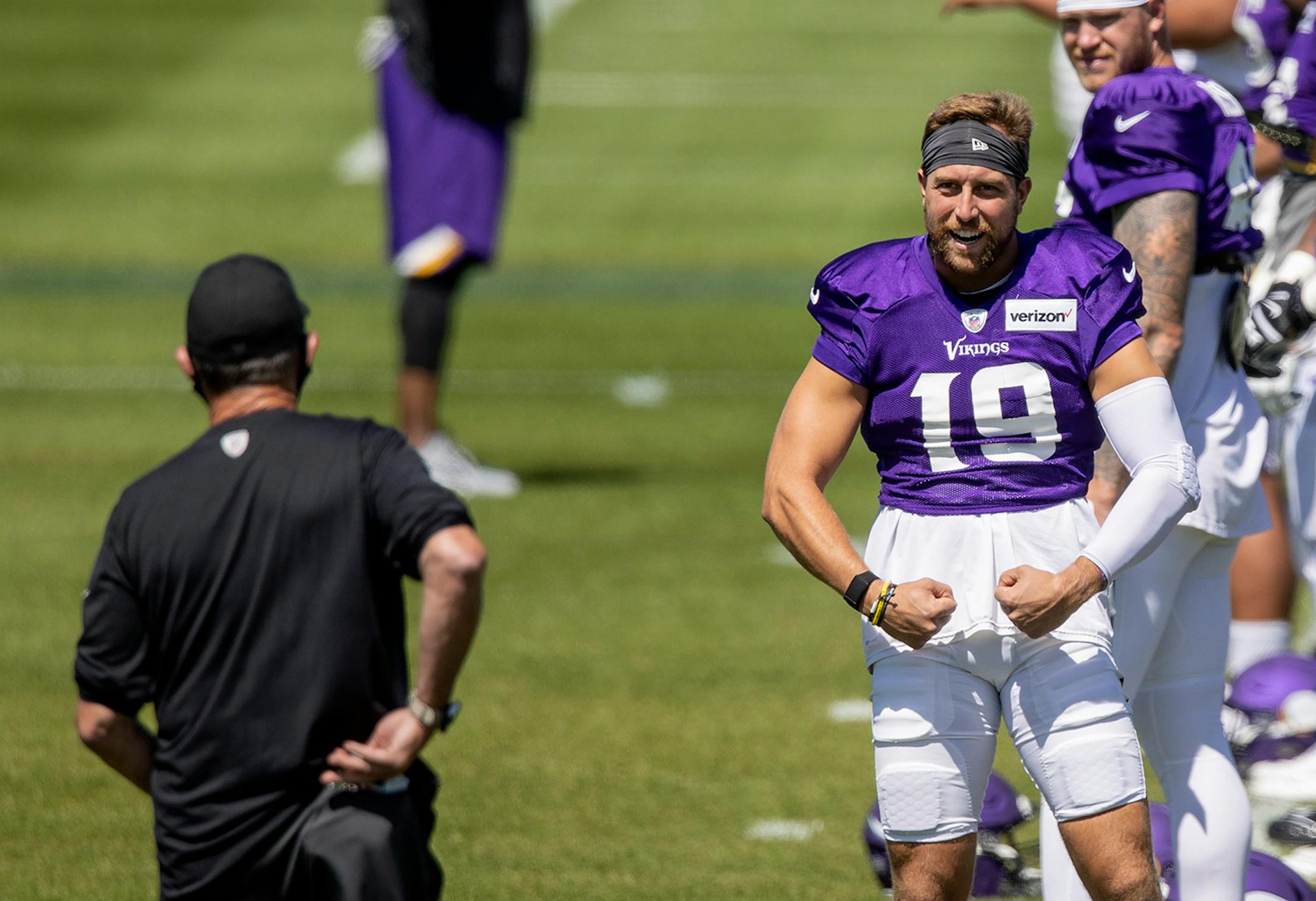 Minnesota Vikings Adam Thielen (19) joked with head coach Mike Zimmer during team warmups.