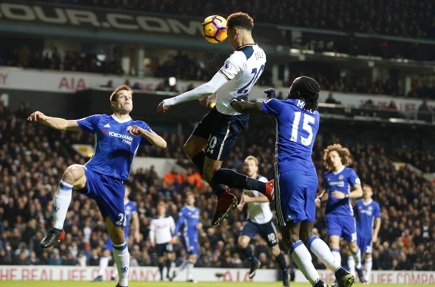 Tottenham's Dele Alli, centre, scores a goal during the English Premier League soccer match between Tottenham Hotspur and Chelsea at White Hart Lane stadium in London, Wednesday, Jan. 4, 2017. (AP Photo/Alastair Grant)