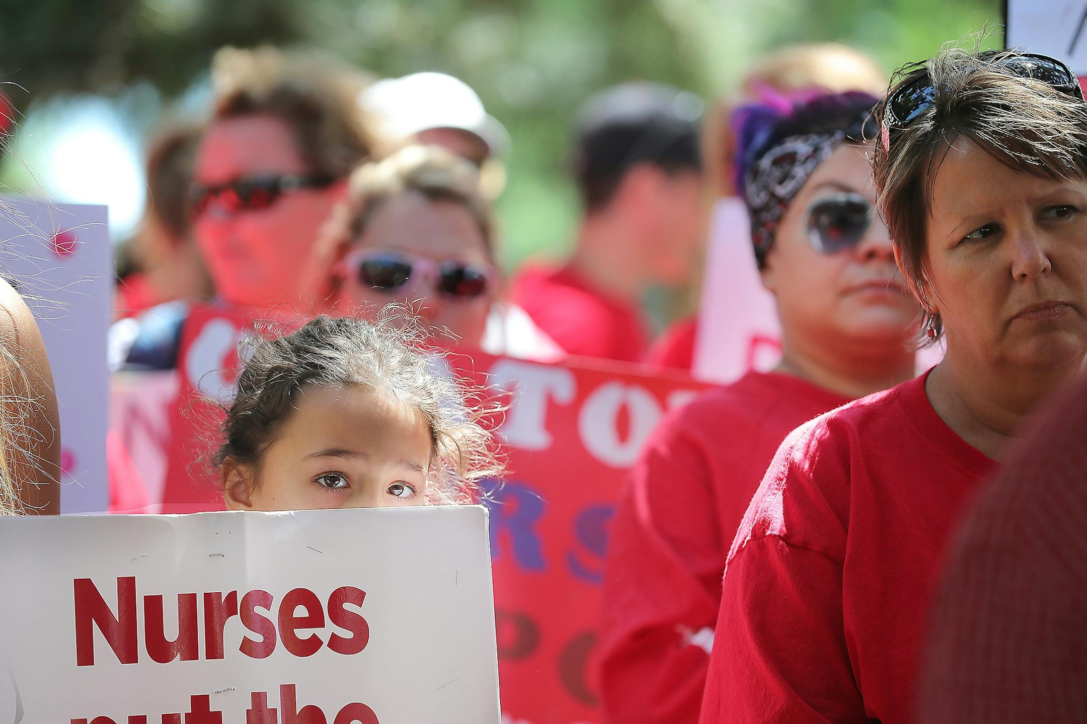 Members of the Minnesota Nurses Association and their families made their way around Abbott Northwestern Hospital as they continued their strike, Monday, June 20, 2016 in Minneapolis, MN.