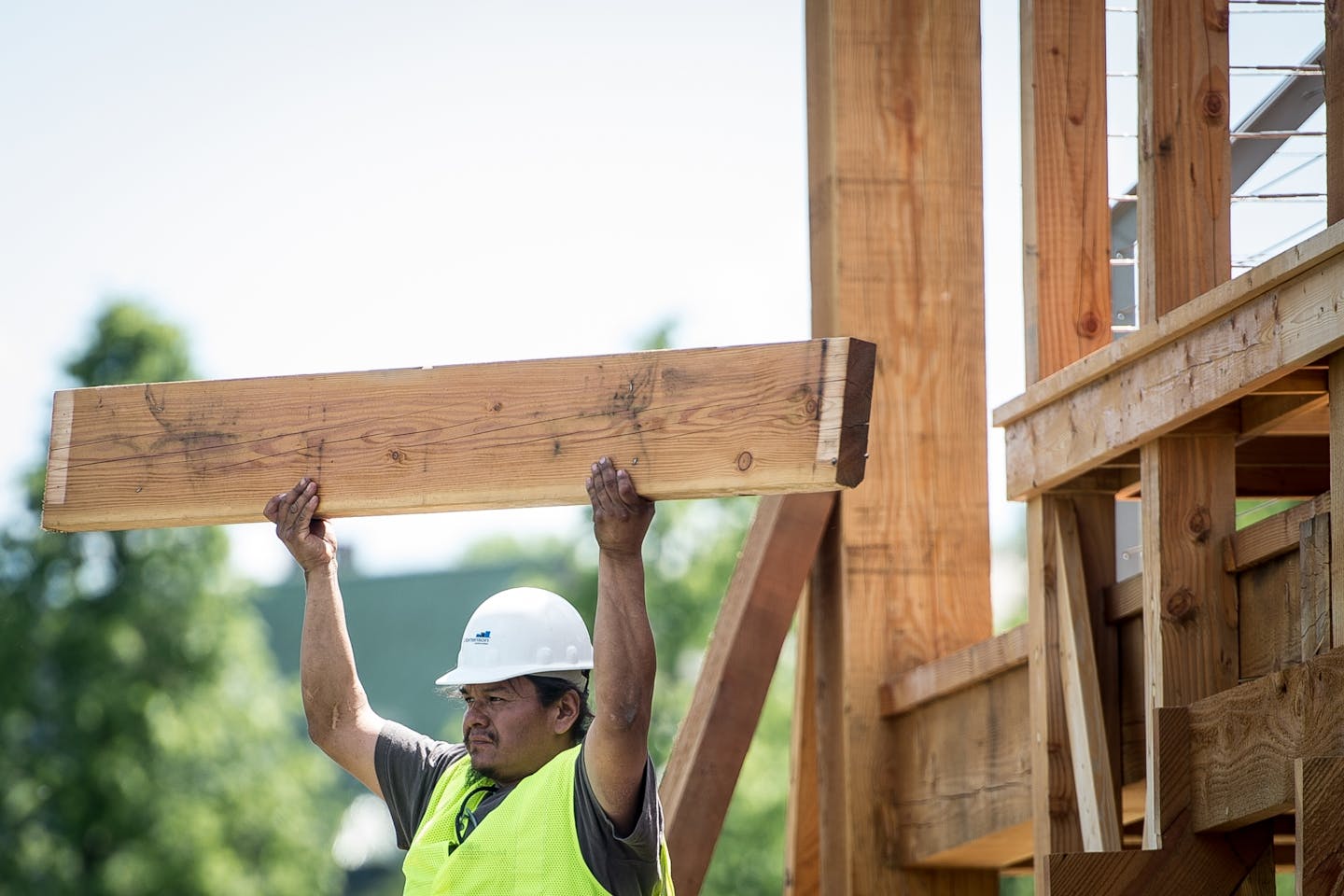 Brian LaBatte, a Lakota and Dakota from Cheyenne River, held up one of the pieces removed from the "Scaffold" Sculpture as its demolishment begun Friday. Staight Line construction