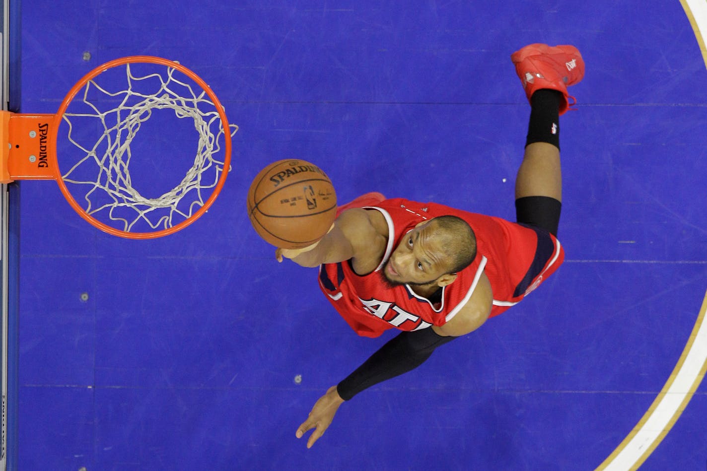 Atlanta Hawks' Adreian Payne in action during an NBA basketball game against the Philadelphia 76ers, Tuesday, Jan. 13, 2015, in Philadelphia. (AP Photo/Matt Slocum)