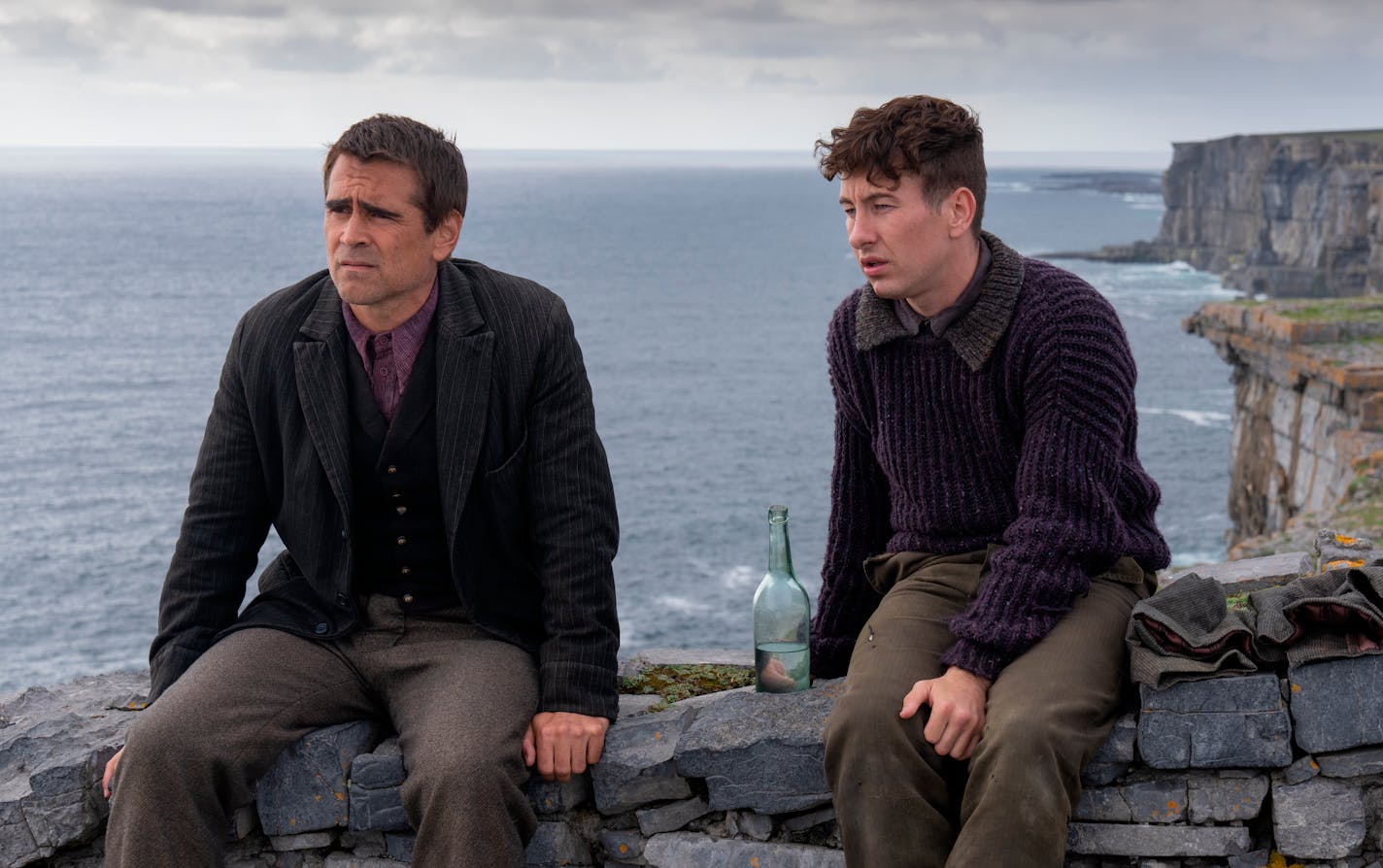 This image released by Searchlight Pictures shows Colin Farrell, left, and Barry Keoghan in "The Banshees of Inisherin." (Searchlight Pictures via AP)